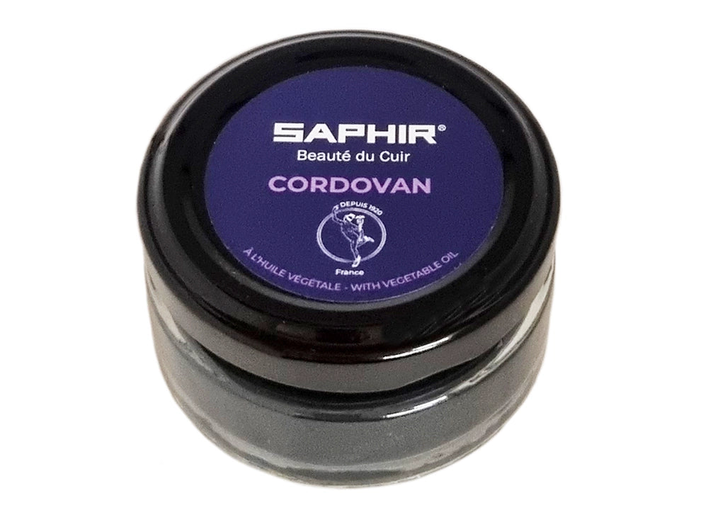 Produktbild föreställande burk med lila lock innehållande skokräm från varumärket Saphir